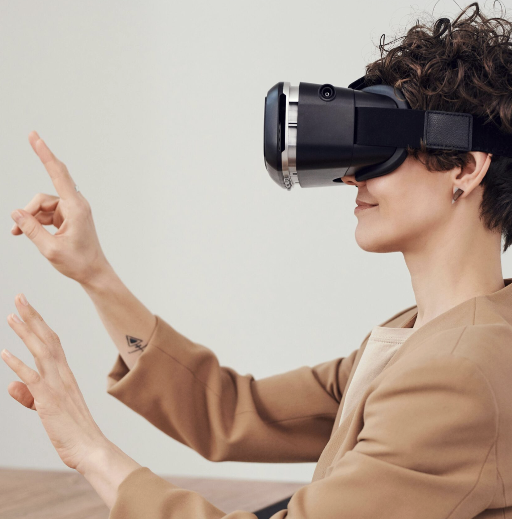 A user in a VR headset interacting with an immersive interface